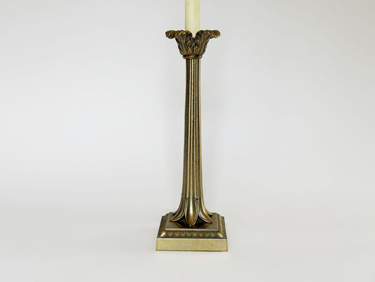 The main structure of the vintage Frederick Cooper brass lamp features vertical grooves to emphasize the column design. The column is topped with the palm leaves, a few inches below where the light bulb sits.