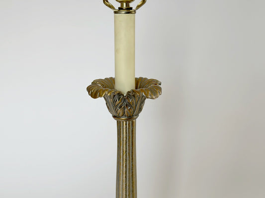 The top of the vintage brass Frederick Cooper column table lamp feature palm leaf fronds.